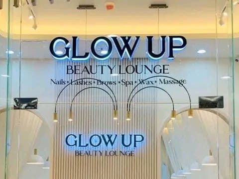 Glow Up Beauty Lounge illuminated sign