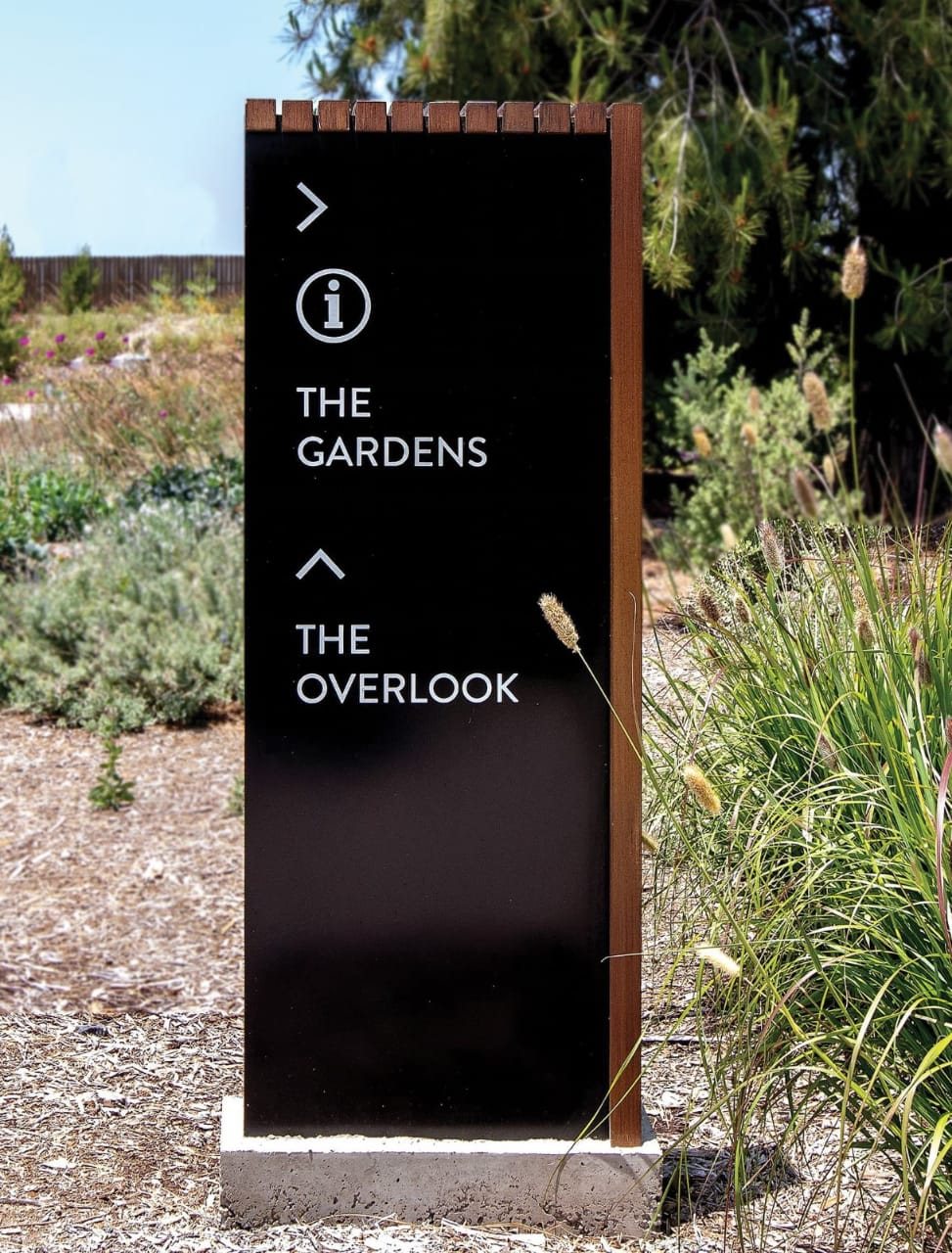 Outdoor wayfinding post sign in a park, made in Kenya